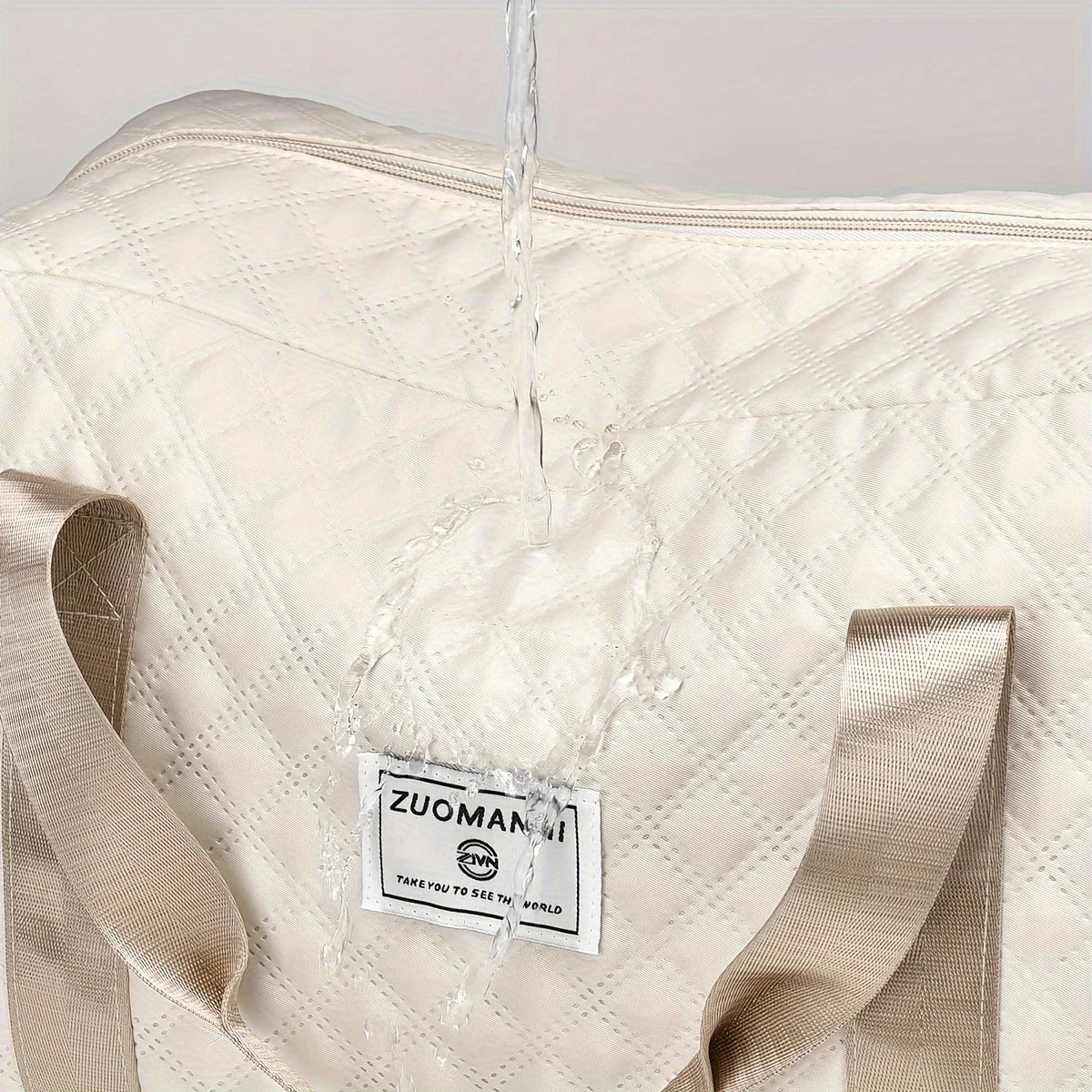 Water-resistant Elarose travel bag in cream with beige straps and diamond quilted pattern