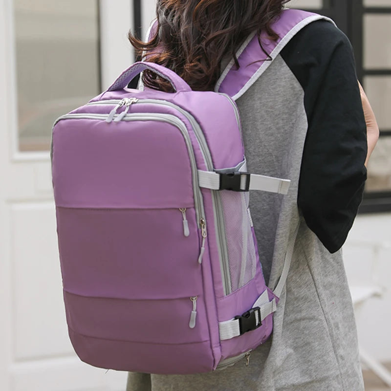 Woman wearing a large lavender backpack with multiple pockets, Elarose modern bag style