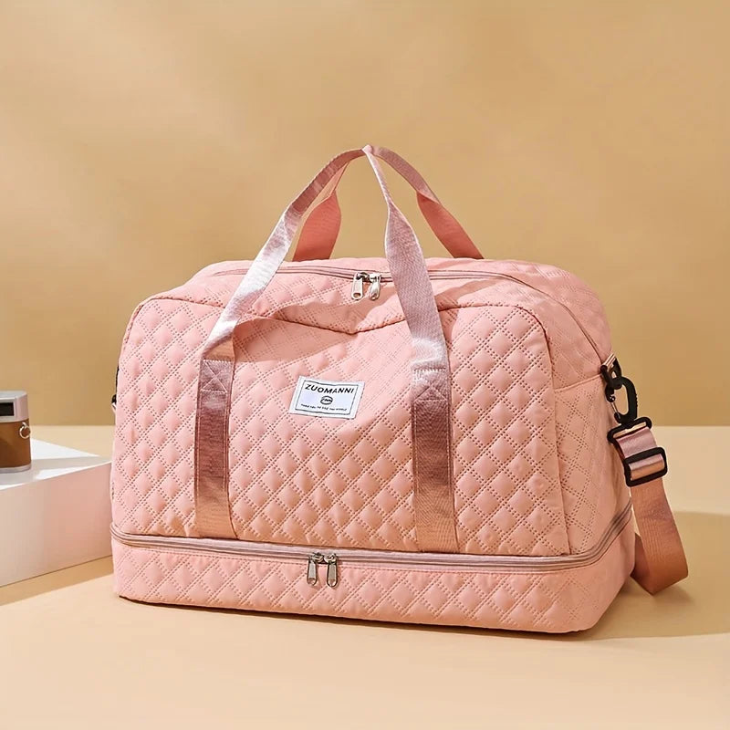 Quilted pink duffle bag with shoulder strap on beige background, Elarose accessory