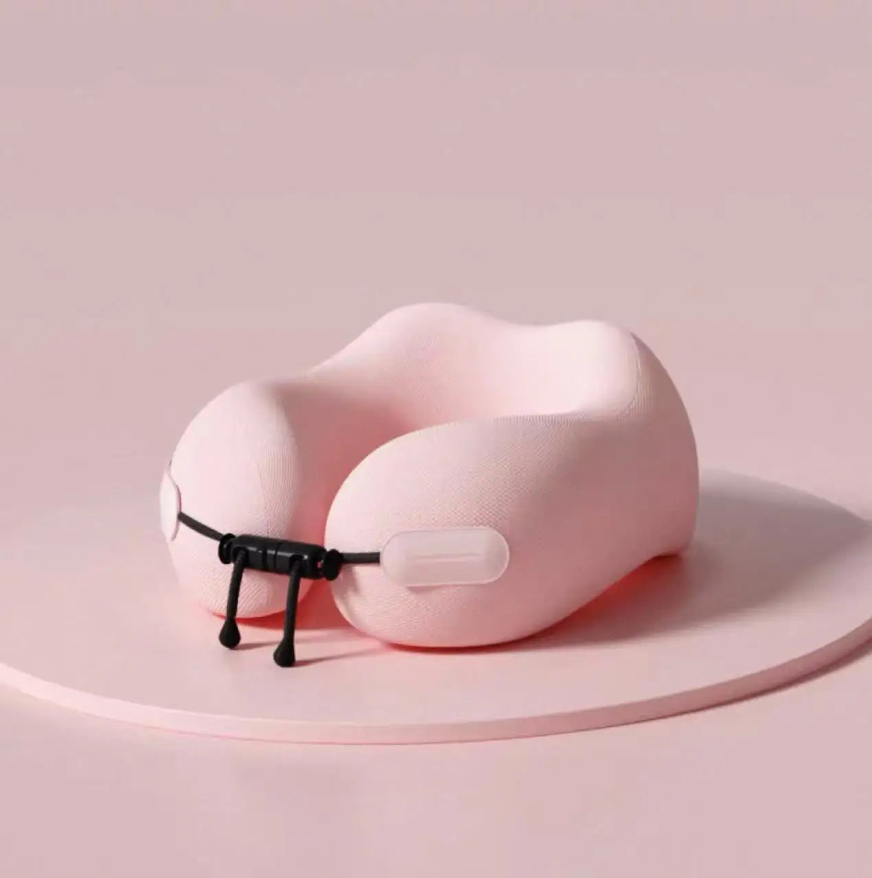 Elarose pink memory foam travel neck pillow with adjustable strap on pastel background