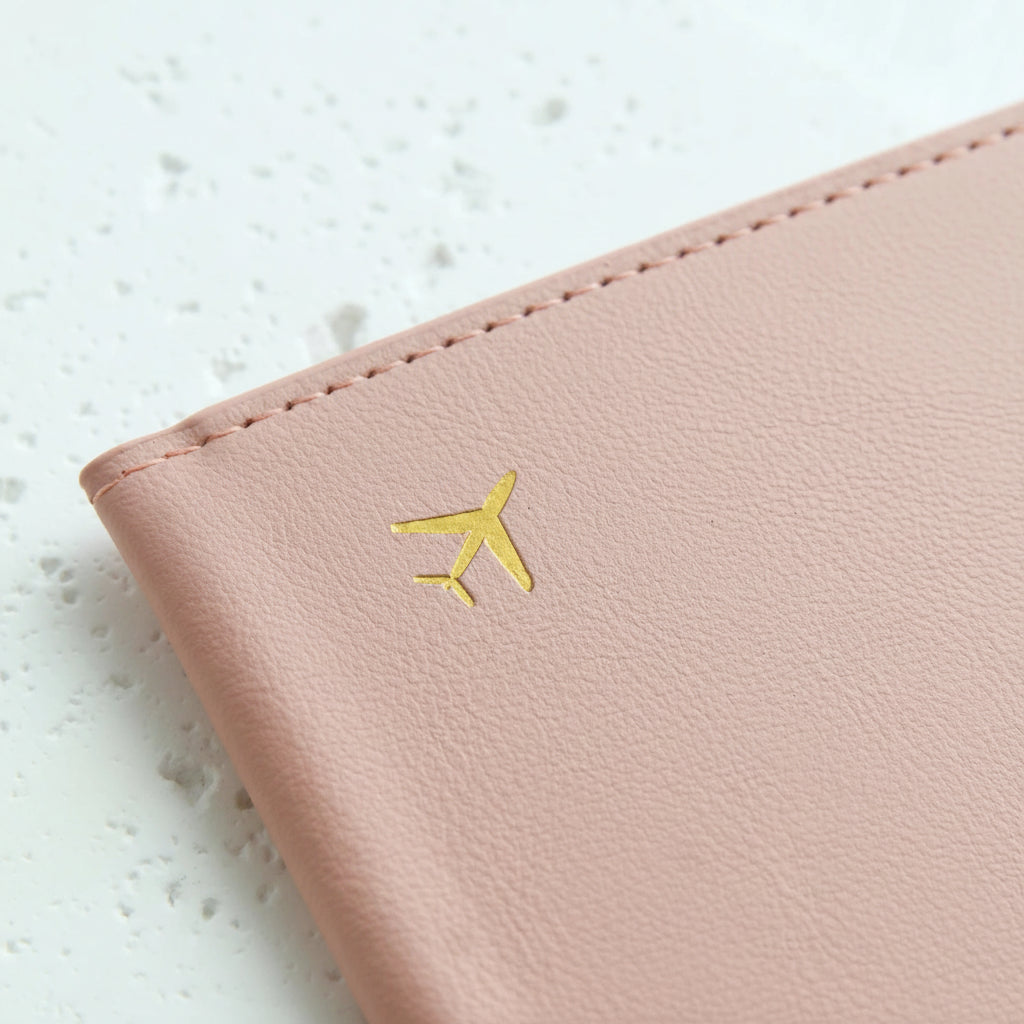 Pink leather travel wallet with gold airplane icon, Elarose accessories