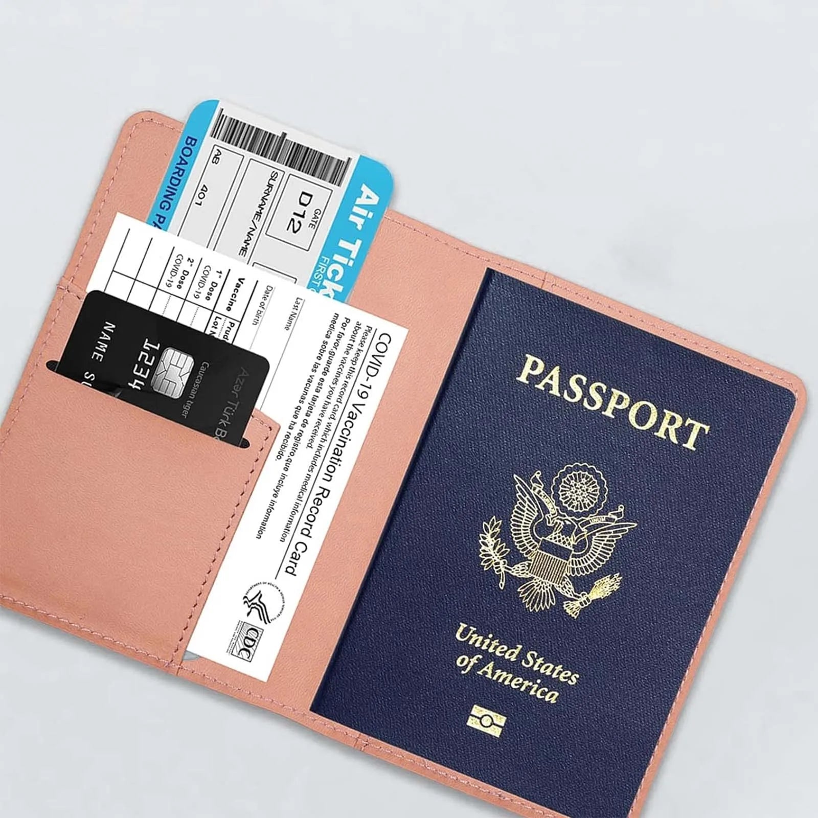 Elarose travel wallet with US passport, boarding pass, credit card, and vaccine card.