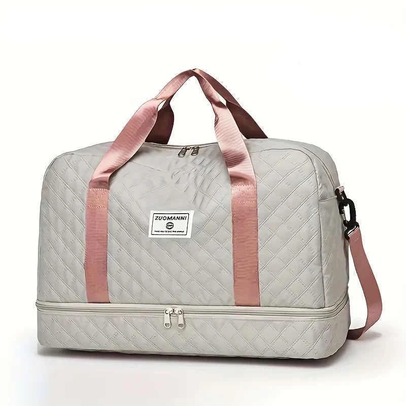 Elarose quilted travel duffel bag in light gray with pink handles and shoulder strap